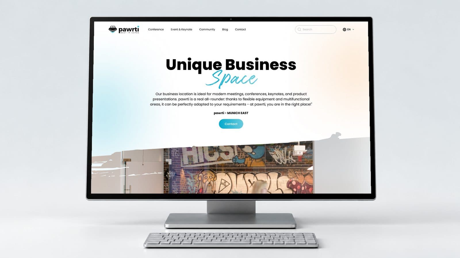 The original Pawrti homepage on a desktop monitor in a light neutral studio presentation