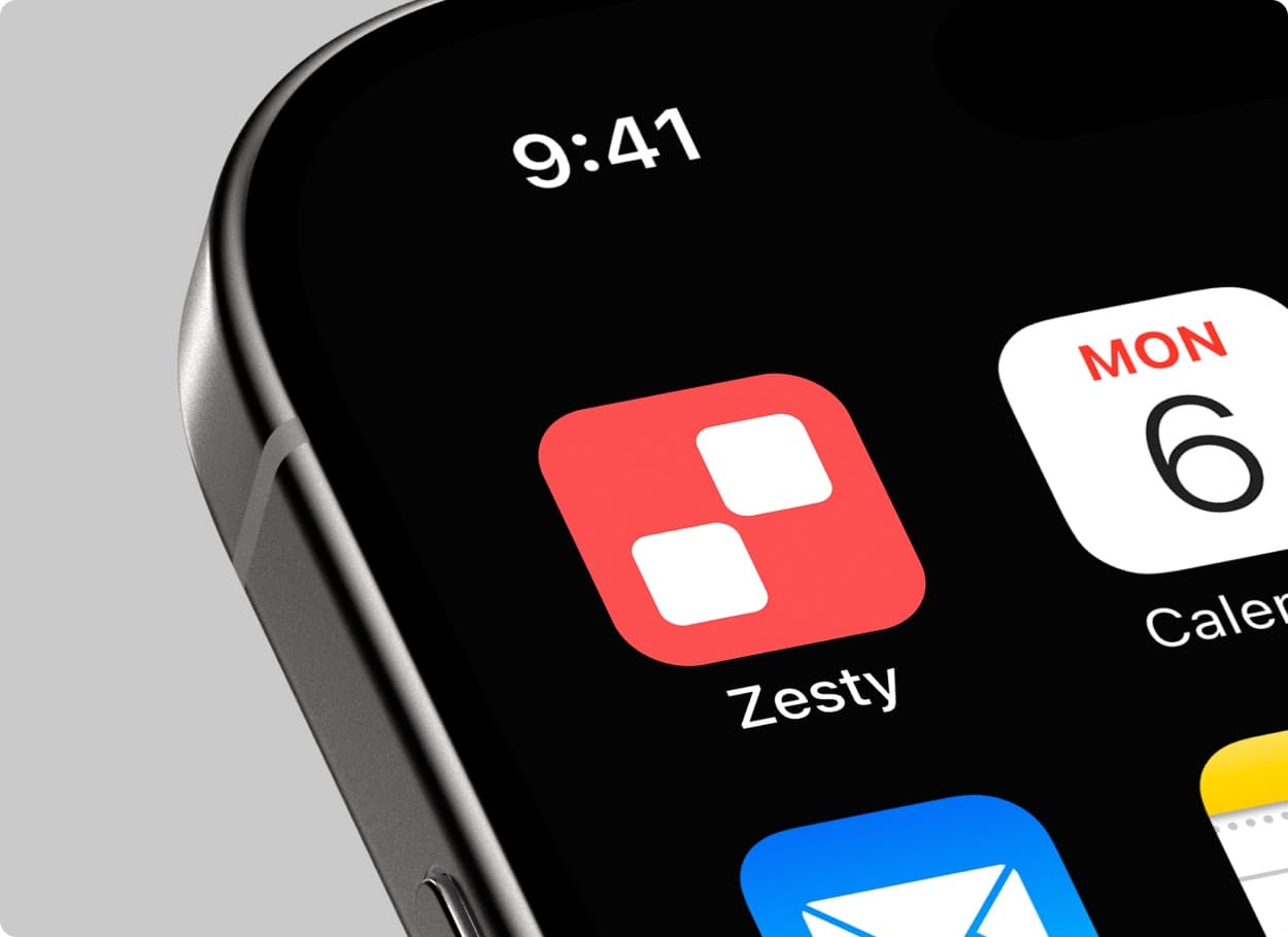 A close view of a phone’s home screen with the red Zesty app icon