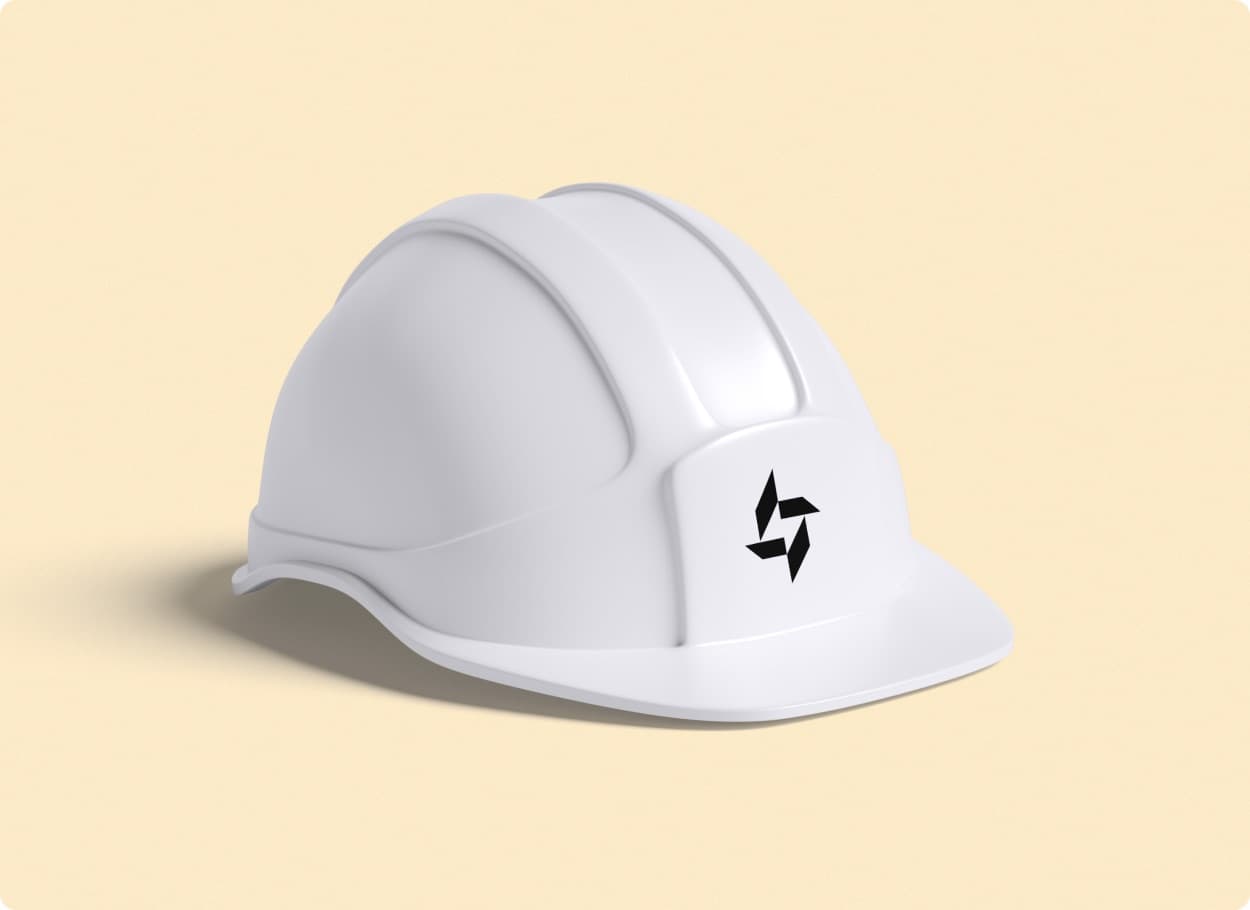 A white hard hat carrying the black Turbica mark