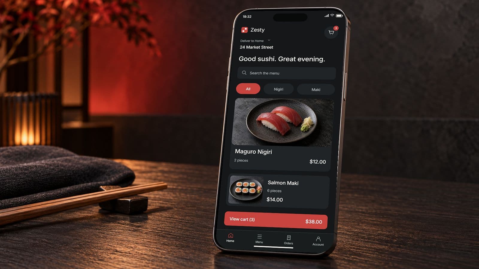 Zesty’s dark sushi menu on a graphite phone in a softly lit restaurant, with nigiri, maki and the cart subtotal