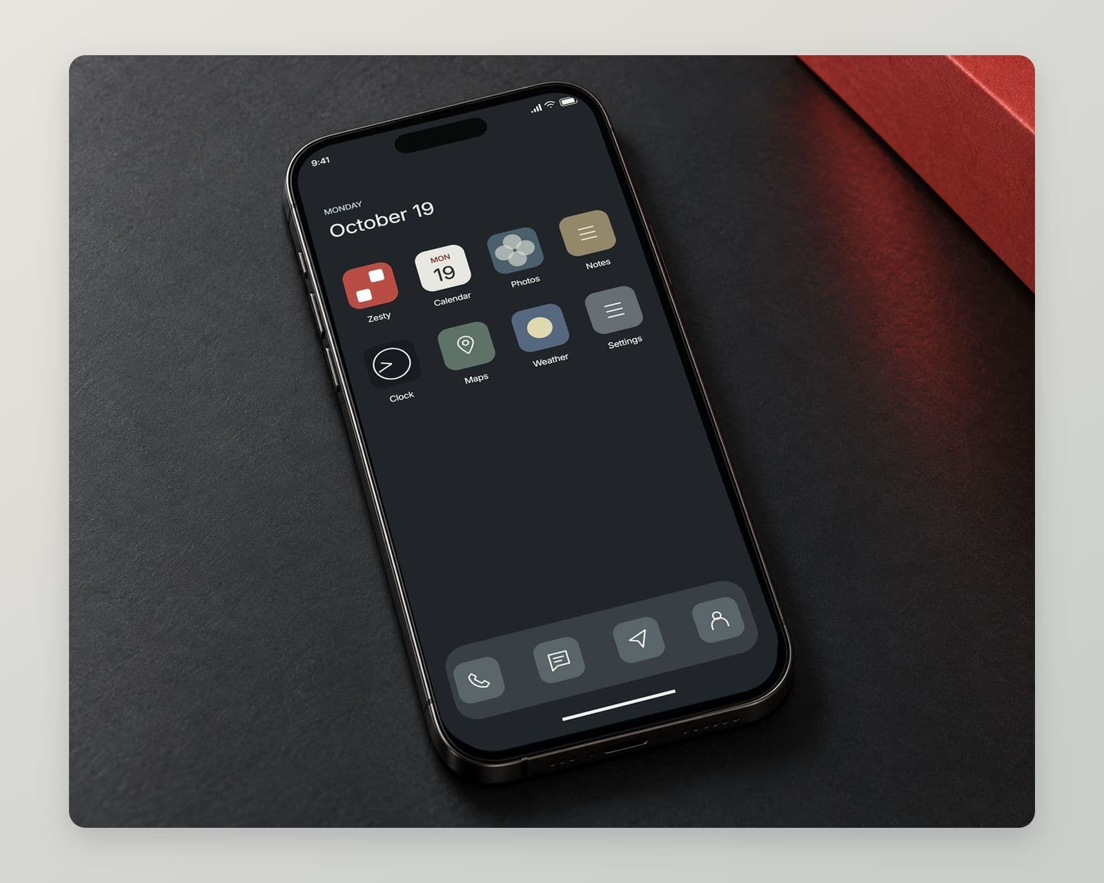 A phone home screen with the red Zesty app icon among other apps