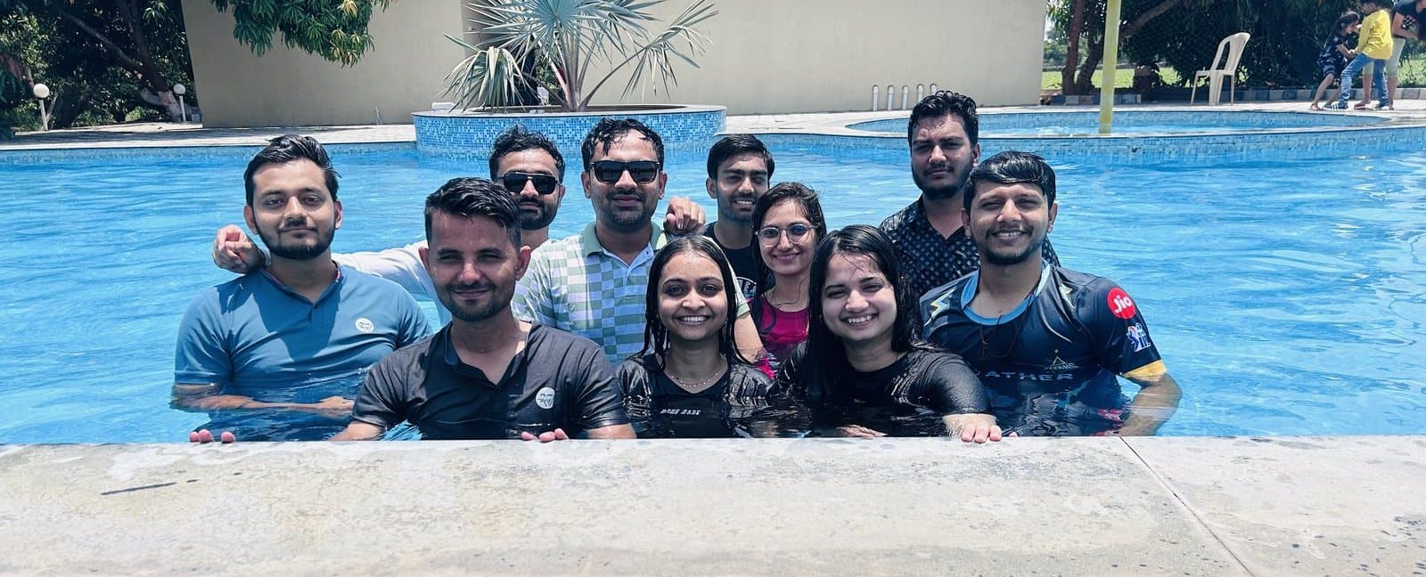The Redlio Labs team together in a swimming pool on a day out