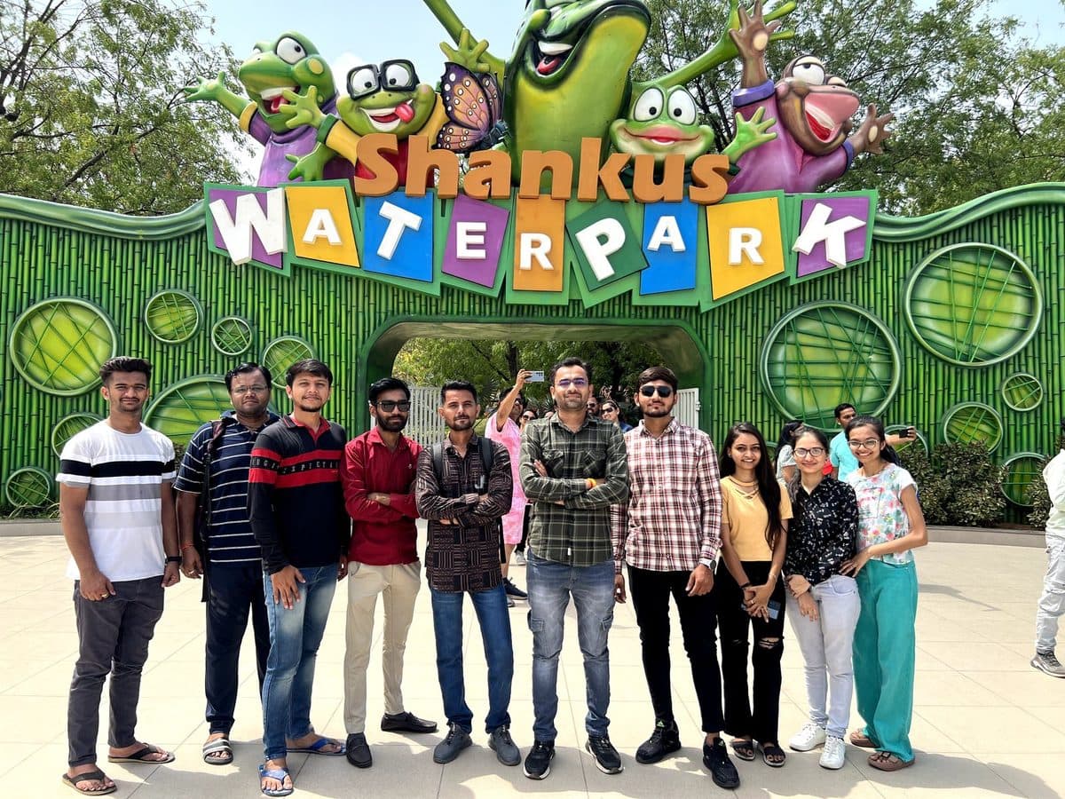 The Redlio Labs team in front of a water park entrance on an outing