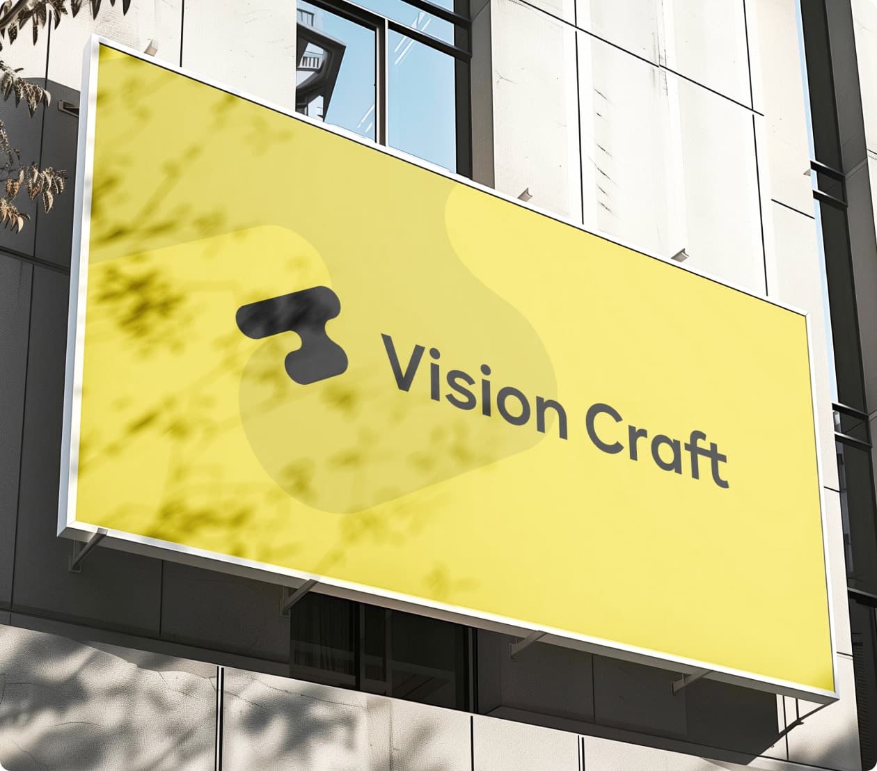 The Vision Craft mark and wordmark on a yellow sign fixed to a building