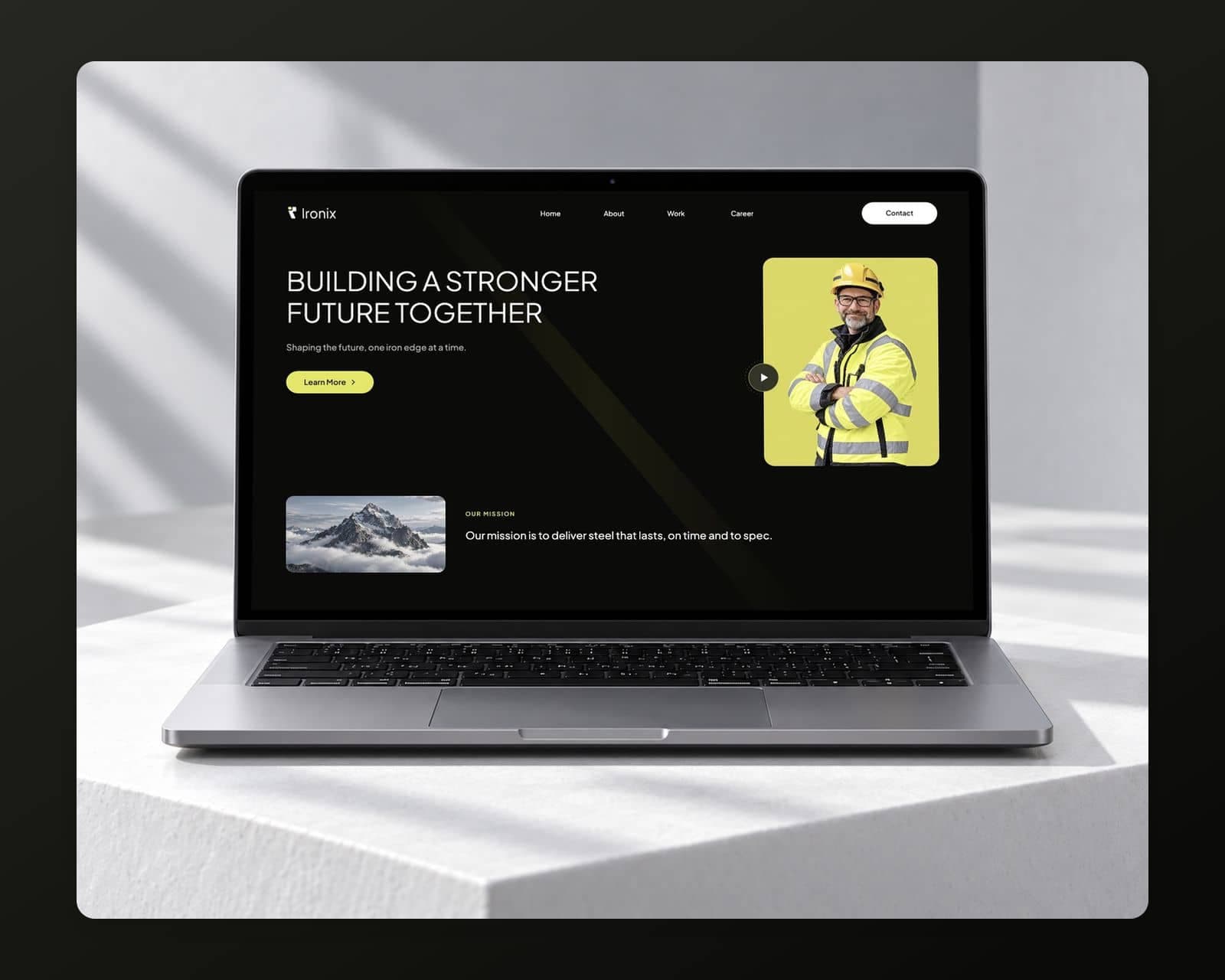 The Ironix homepage on a laptop with Home, About, Work and Career links, the headline Building a Stronger Future Together, a yellow Learn More button and a mission section