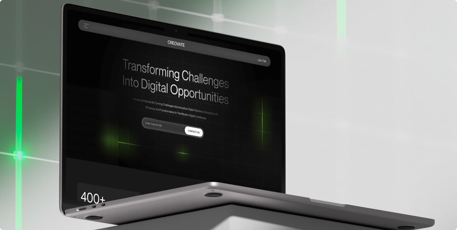 The Creovate website on a laptop, with the headline Transforming Challenges Into Digital Opportunities