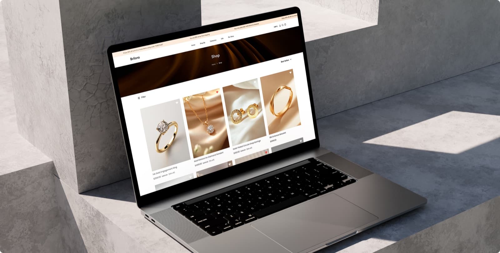 The Brilora shop page on a laptop, showing a grid of rings, a pendant and earrings with their prices