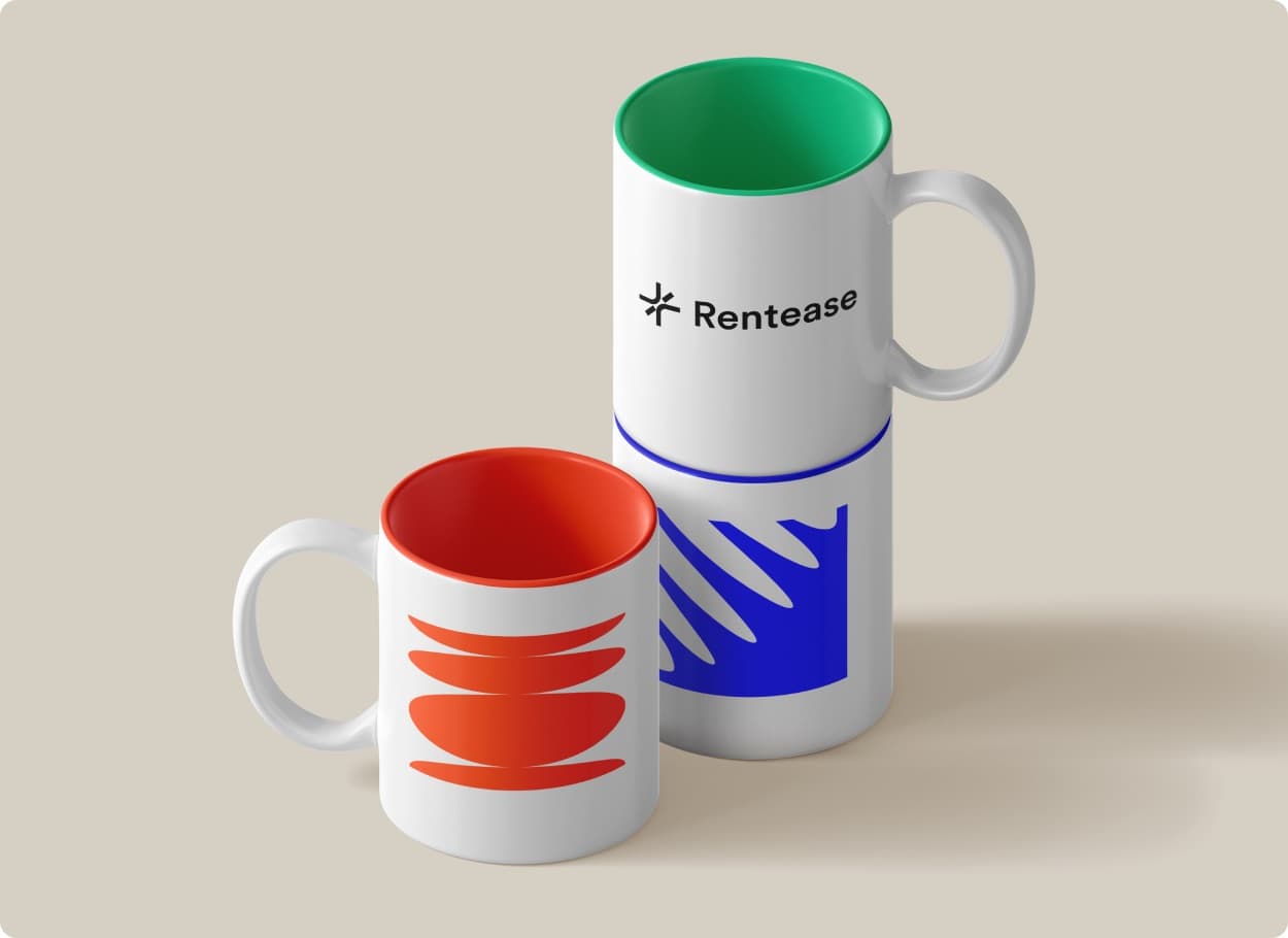 Three white mugs with coloured patterns, one carrying the Rentease mark and wordmark