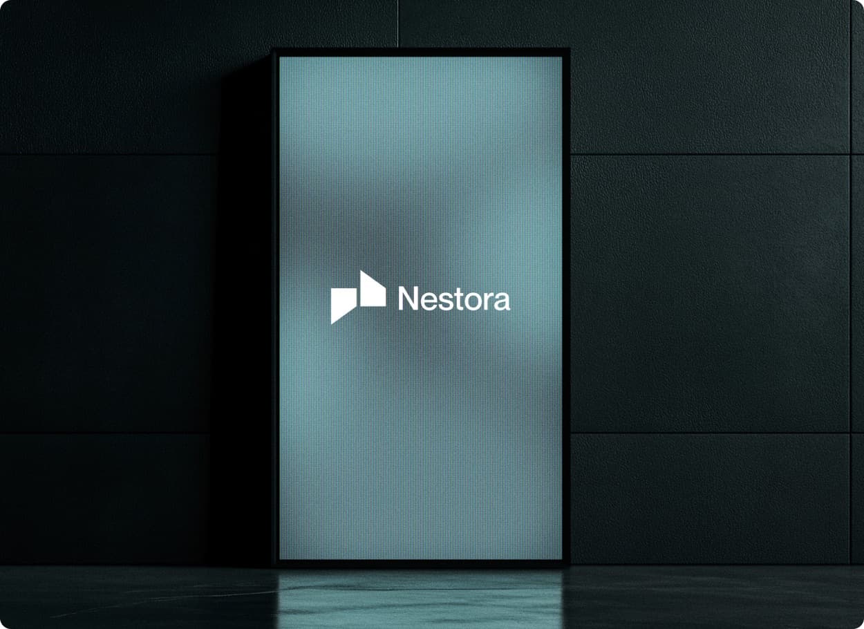The Nestora mark and wordmark in white on a tall blue-grey display panel against a dark wall