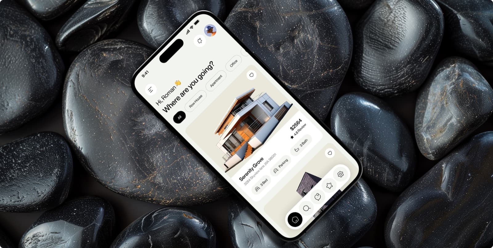 The Nestora app on a phone resting on dark stones, with the greeting Where are you going? above a listing card for a house called Serenity Grove