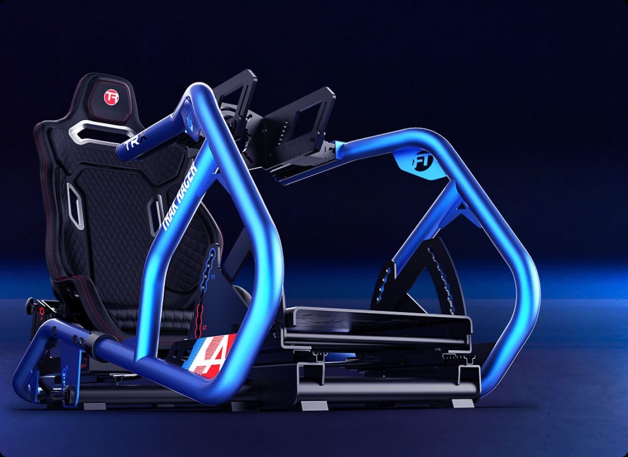 A Trak Racer racing simulator cockpit with a blue tubular frame and a black racing seat