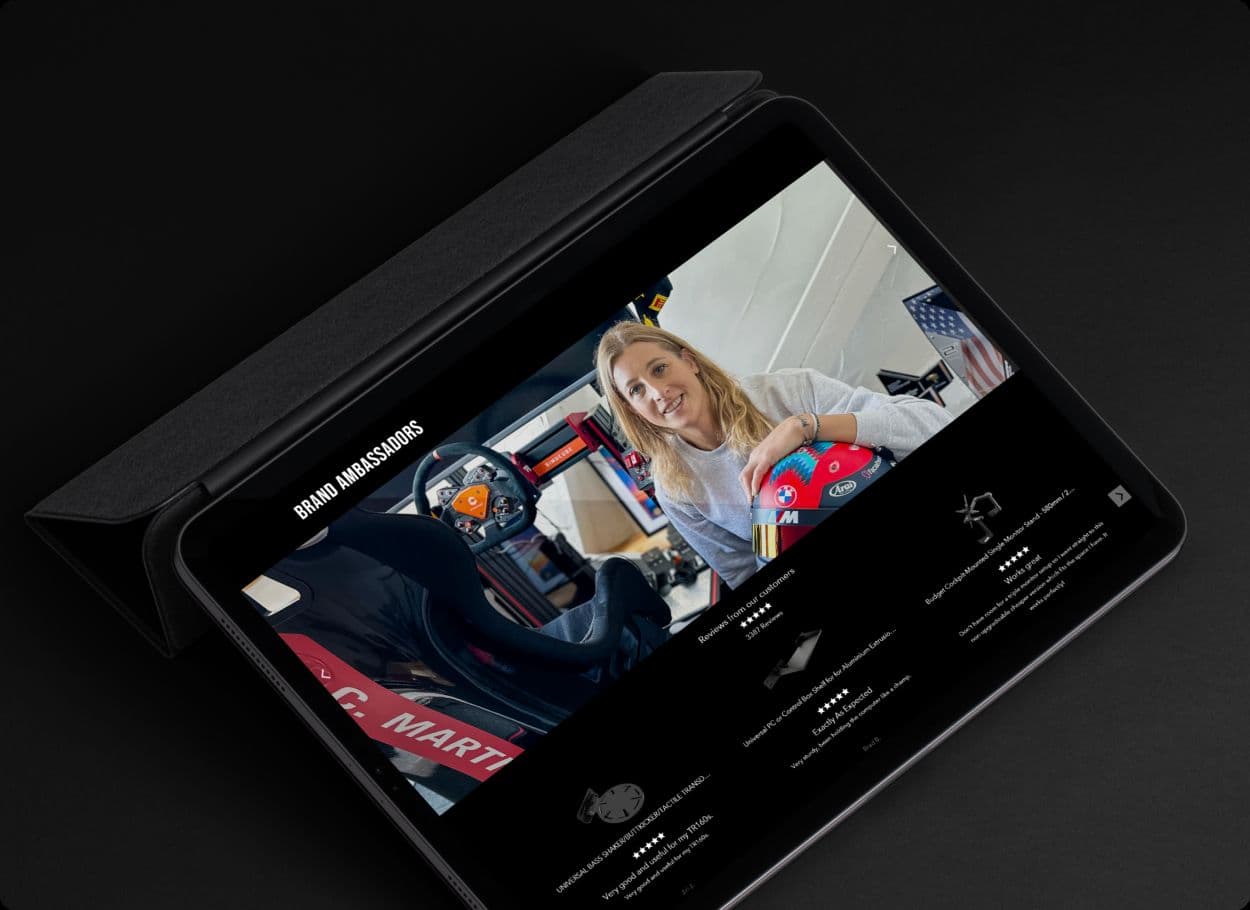 The Trak Racer store on a tablet, showing a driver seated in a racing simulator