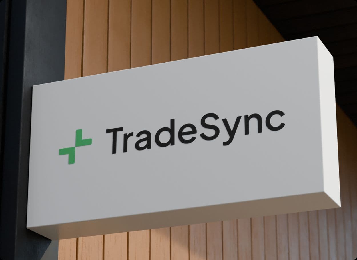 The TradeSync wordmark on a white sign against a timber wall