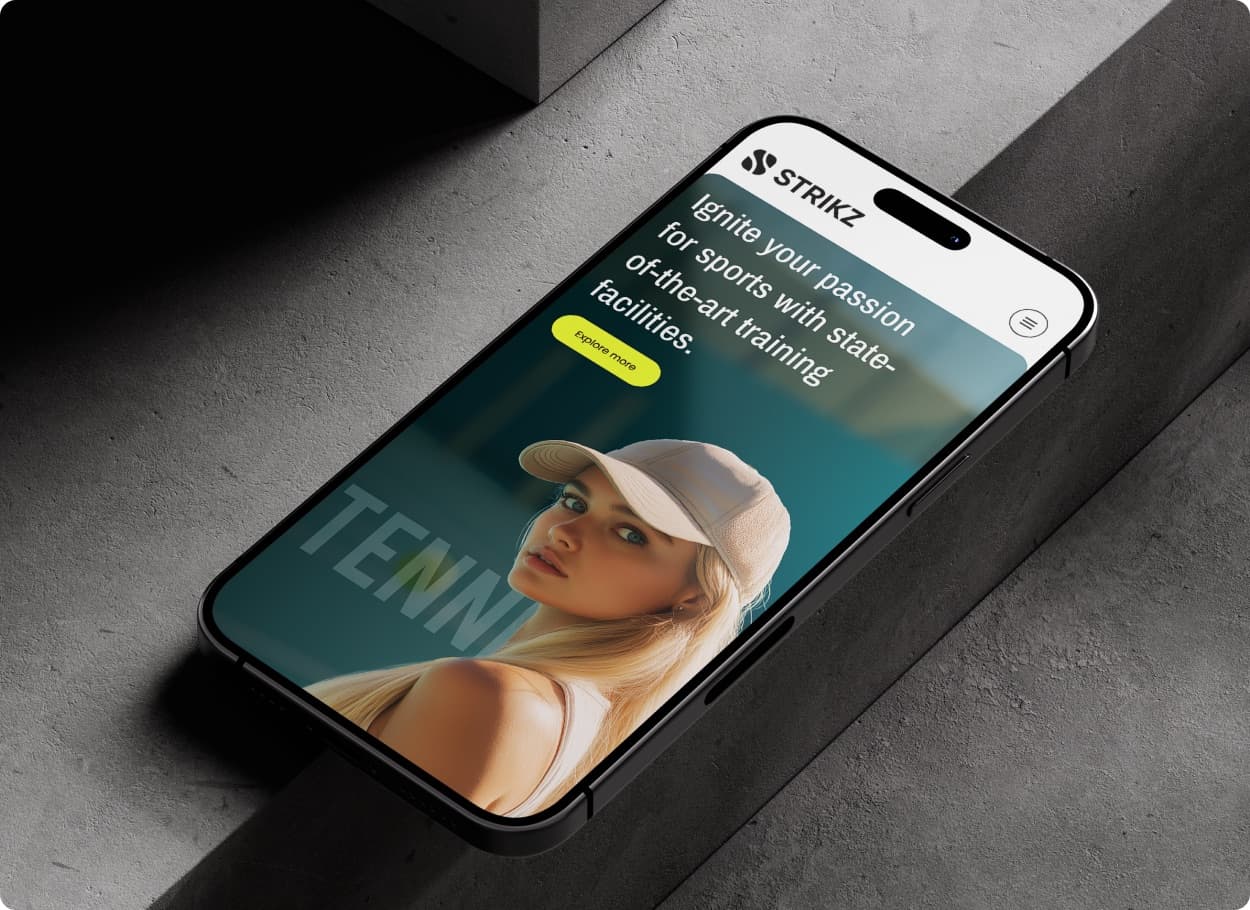 The Strikz website on a phone, with the headline Ignite your passion for sports and an Explore more button