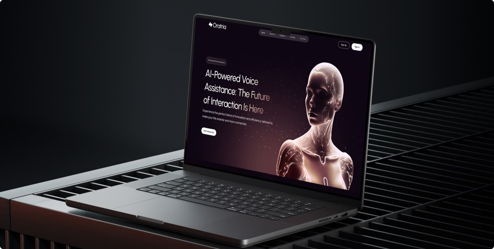 The Oratria website on a laptop, with the headline AI-Powered Voice Assistance: The Future of Interaction Is Here beside a glowing figure